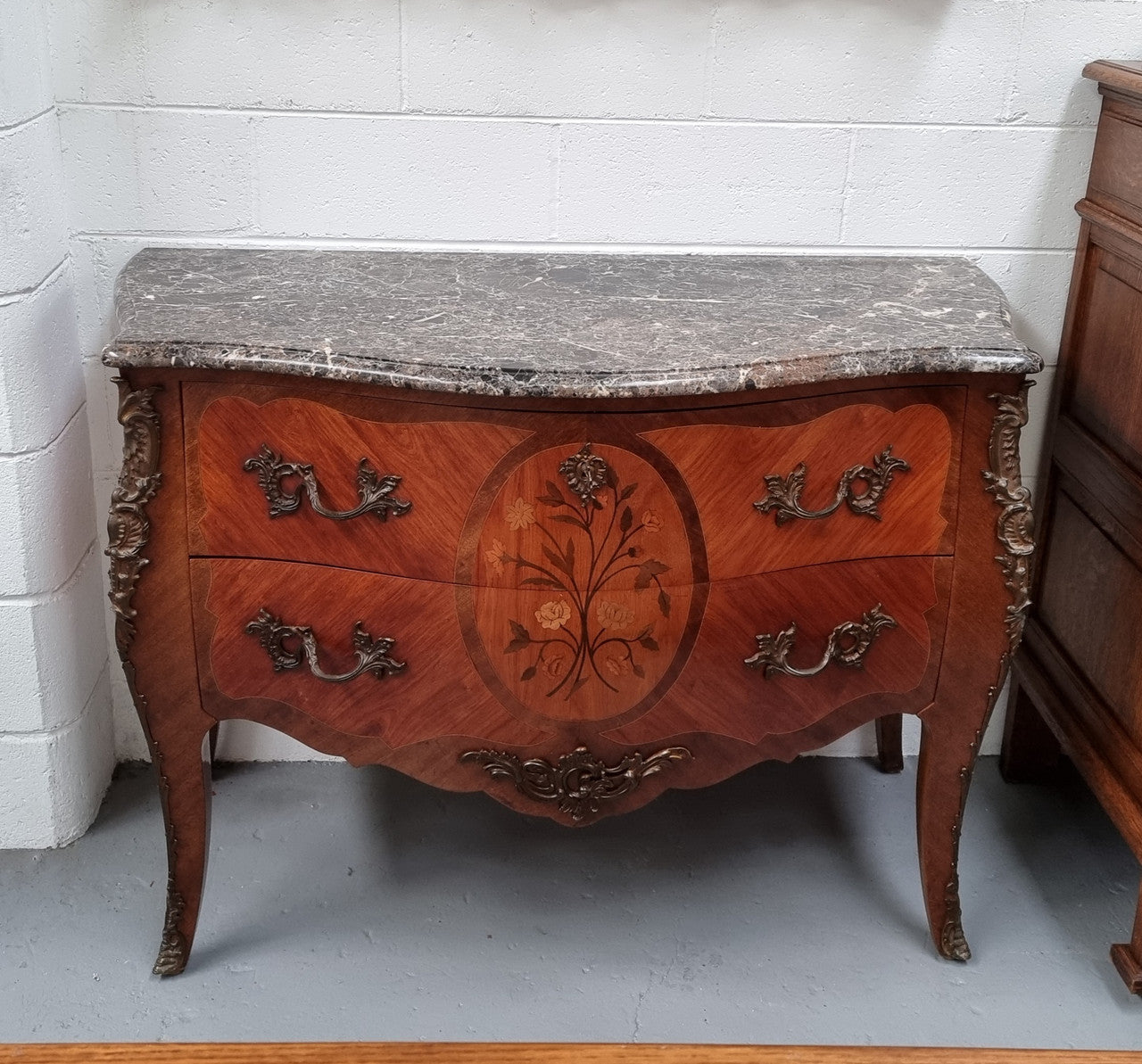 Beautiful French walnut Louis XV style two drawer commode. With a lovely floral marquetry inlaid design and marble top. It is in good original detailed condition.