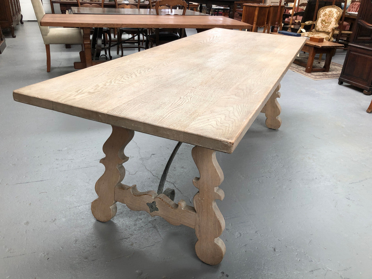 Limed French Oak Farmhouse table with decorative iron base. In good original detailed condition.