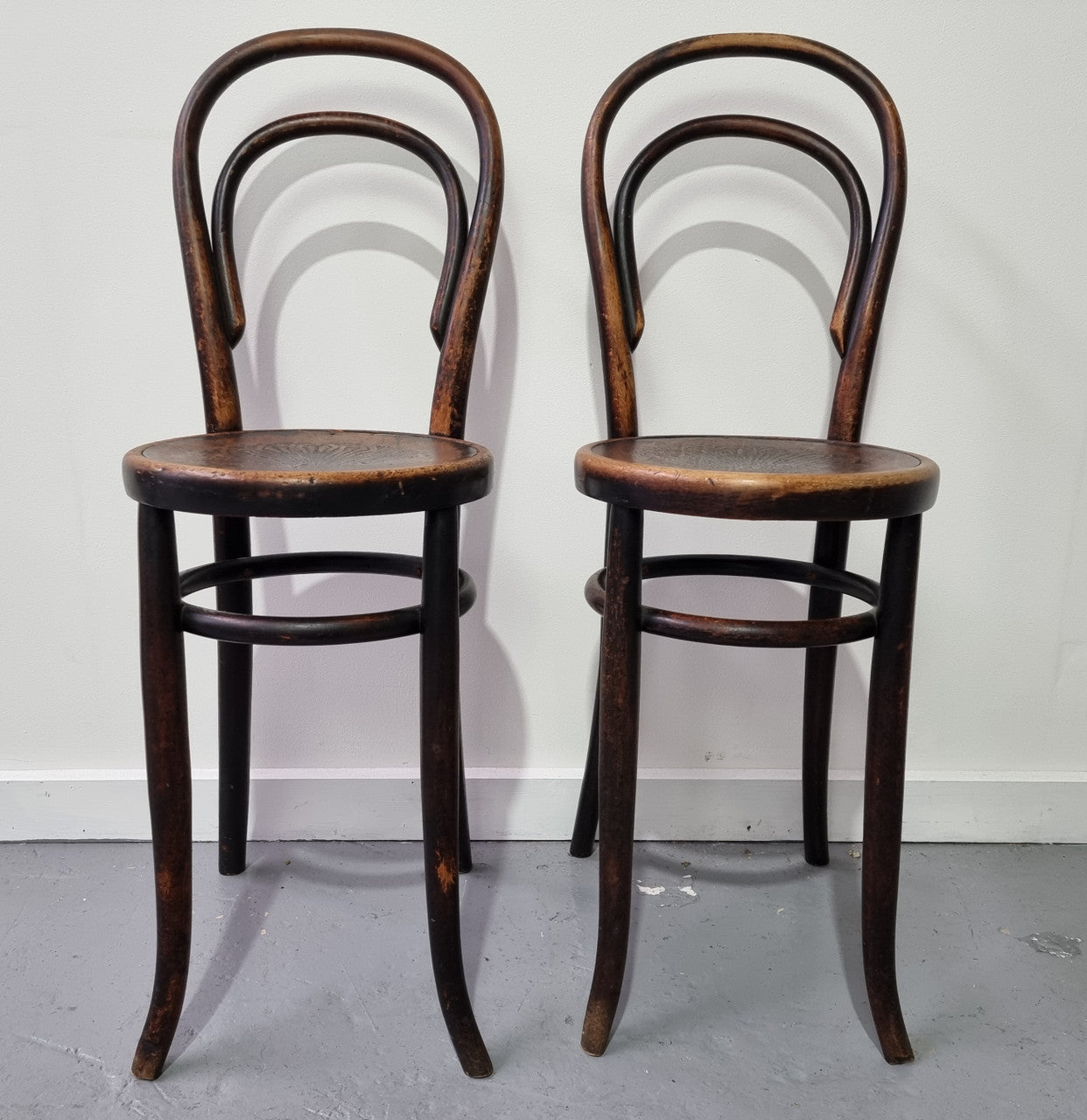 Rare petite cafe Bentwood chairs with original shell embossed seats. They are in very good original condition. They would make great addition to your breakfast bar.