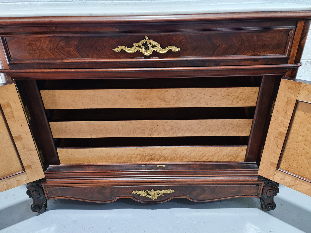Stunning Rosewood Marble Topped Secretaire with two cupboards. Cupboards open to three fitted drawers and an additional secret drawer beneath the cupboard. All sitting on lovely carved legs and decorated with ormolu mounts. Circa: 1860. In good original detailed condition.