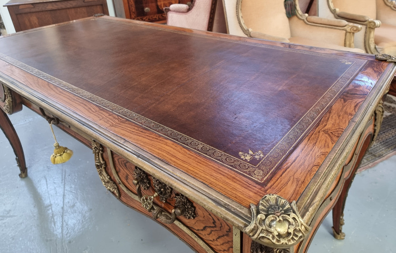 Beautifully fully restored French Antique Rosewood partners desk with beautiful ormolu detail and lovely tooled new leather top. There are three functioning drawers on one side for all your storage needs.
