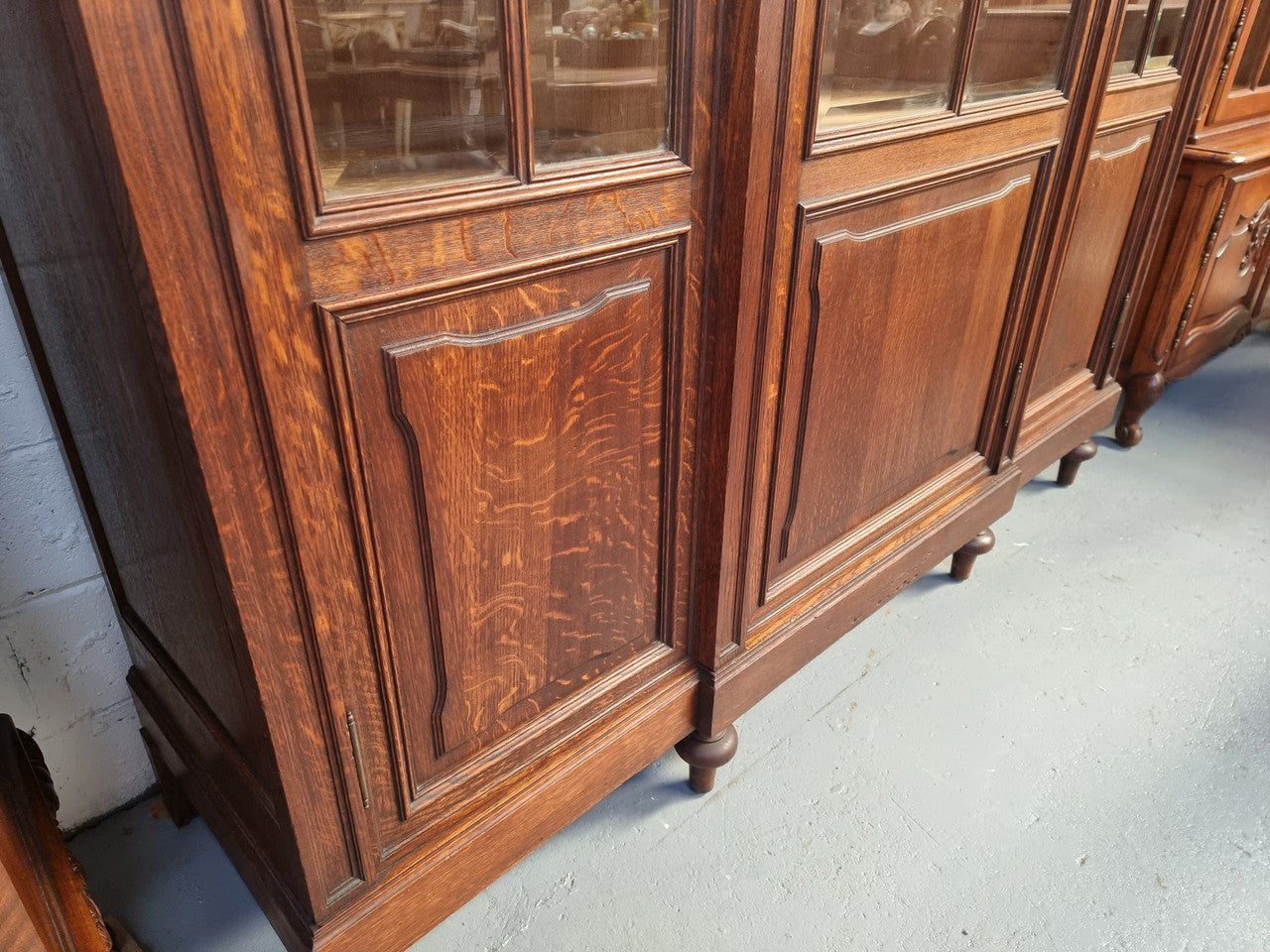 Late 19th Century French Oak three door bookcase. It has fully adjustable shelfs and is in good original detailed condition.