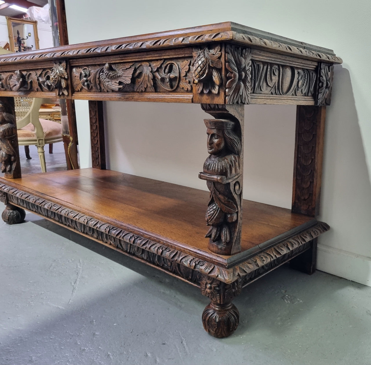 19th Century French Oak Henry the 2nd style console/side table/ TV unit with two drawer with beautiful carvings. It is in good original detailed condition.