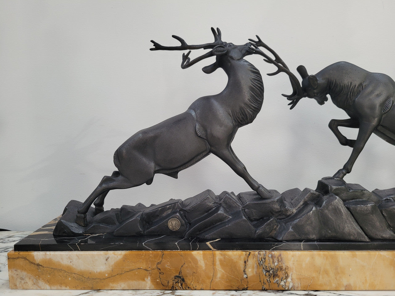 French Art Deco bronzed spelter and marble"Fighting Stags" statue by renowned artist and sculptor "Irenee Rochard".