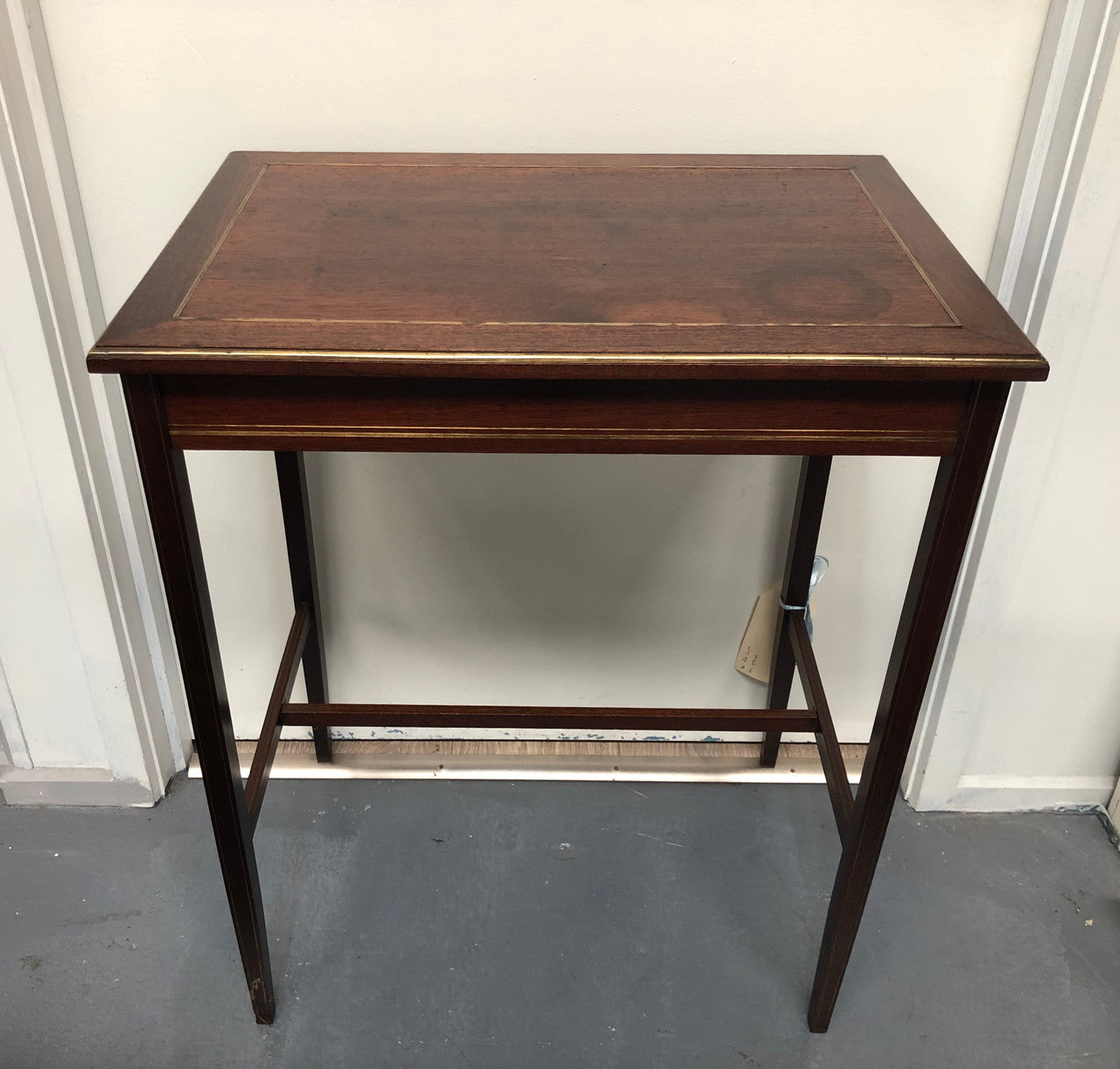 Elegant rectangular mahogany French brass inlaid occasional table. Is in good original condition.