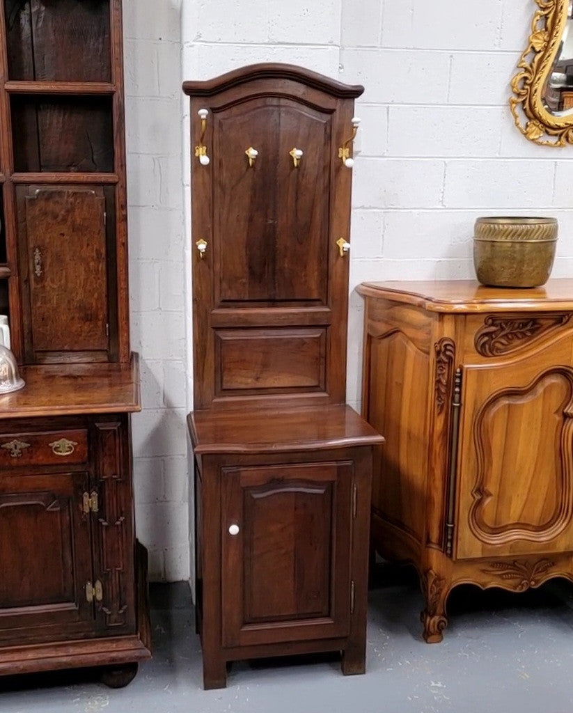 Lovely entrance piece with shelf and single door cupboard, topped with a section for hanging jackets, hats etc. Sourced from France and in good original detailed condition.