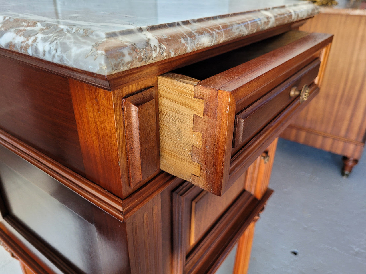 Pair of Henry II style Walnut bedside cabinets with a marble top. Circa 1920s and in good original condition.