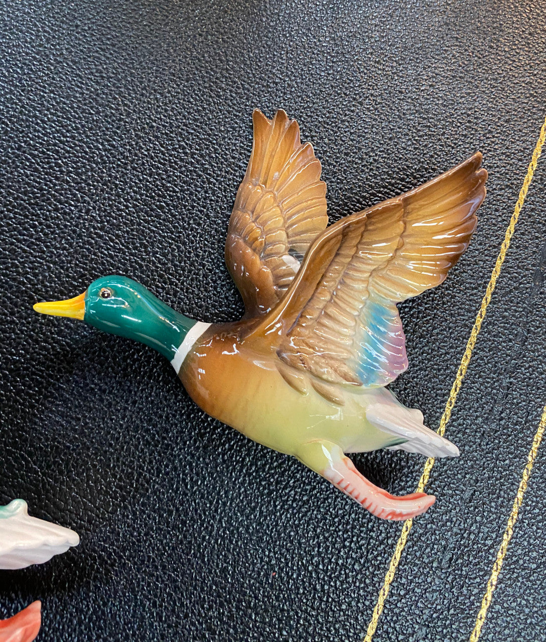Set of three vintage flying duck wall ornaments. Measurements are for largest duck.