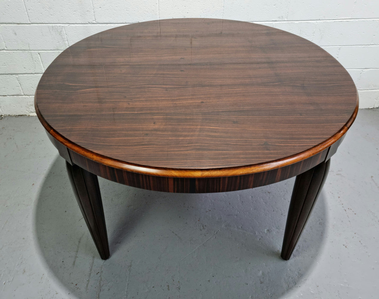 French Art Deco Macassar Ebony circular dining table by "Jules Leleu". In very good original detailed condition.