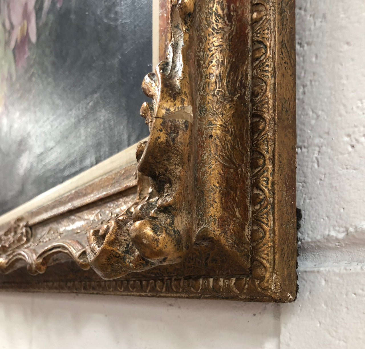 Signed French oil on canvas painting of "Orchids In Basket" In a beautiful ornate gilt frame. In good original detailed condition.