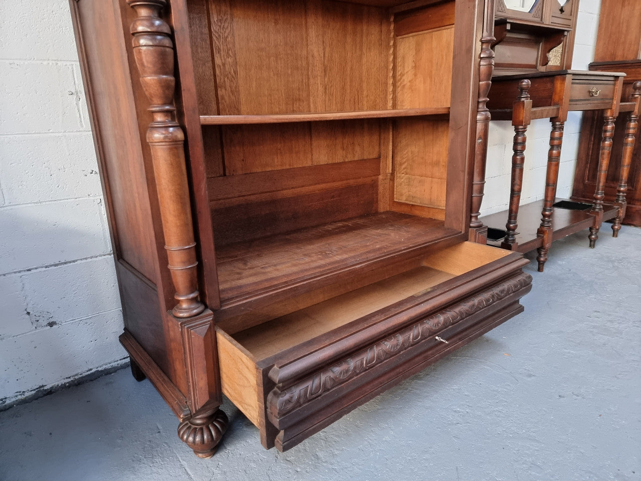 Henry II style 19th century walnut open bookcase with drawer which was originally an armoire now converted to a bookcase. It comes with four adjustable shelves. Is in good detailed condition.