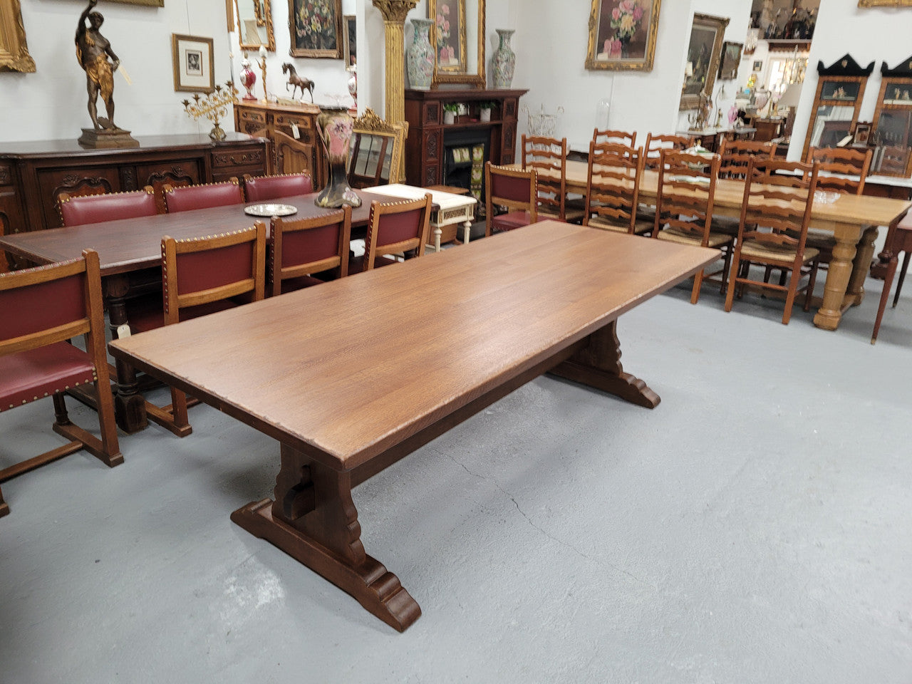 Sensational long French Oak farmhouse table of large proportions on a stretcher base. It has been fully restored with a hard oil water resistant finish. This fabulous table would seat 10 to 12 people.