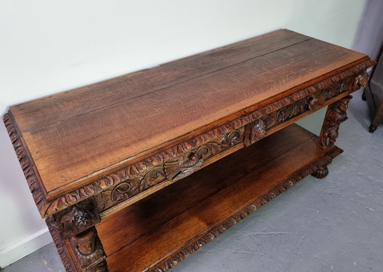 19th Century French Oak Henry the 2nd style console/side table/ TV unit with two drawer with beautiful carvings. It is in good original detailed condition.
