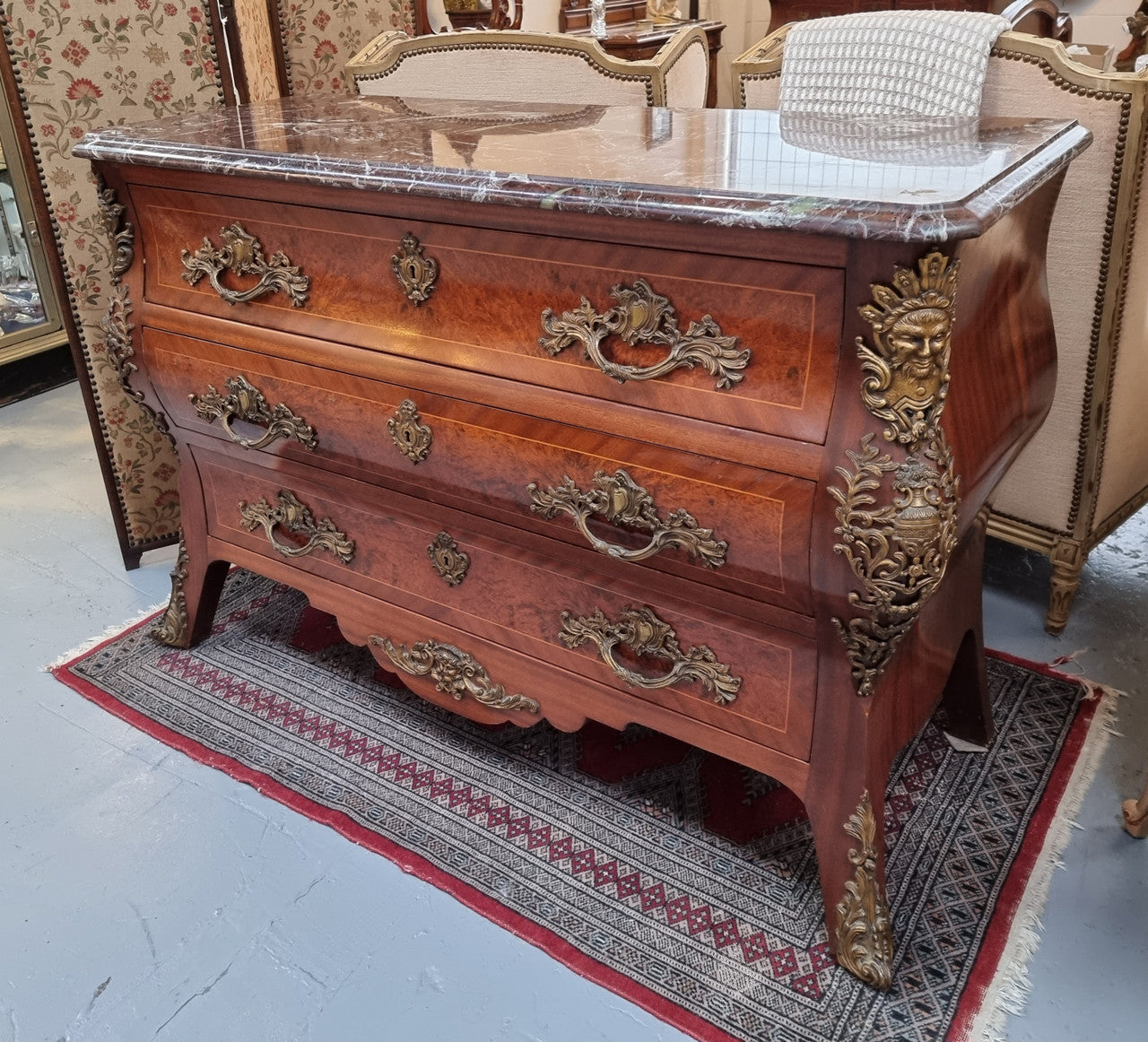 French Louis XVI style three drawer commode with amazing coloured marble. It has decorative brass mounts and is in very good original detailed condition.