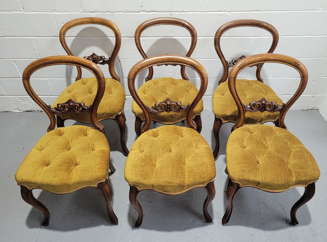 Set of six upholstered Victorian balloon back chairs. In good original detailed condition.