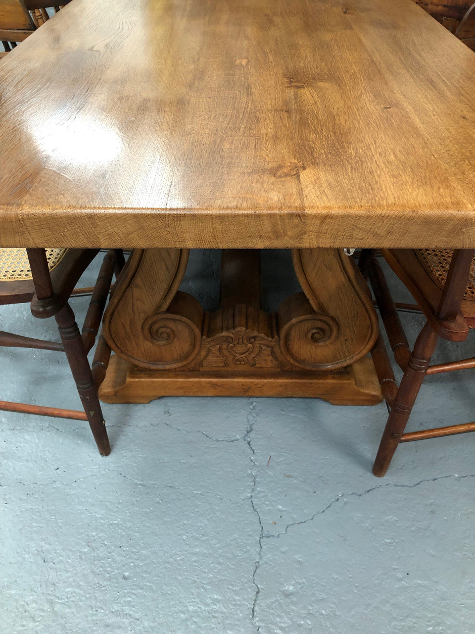 French oak fixed farmhouse table with a charming harp-shaped base. In good original condition and can seat 6-8 people. Circa 1930.