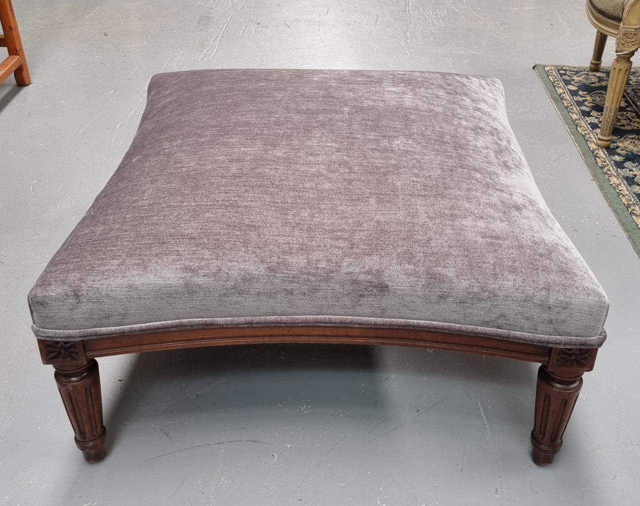 Amazing French Louis 16th Style large walnut footstool with new grey upholstery. Circa: 1900. In good detailed condition.