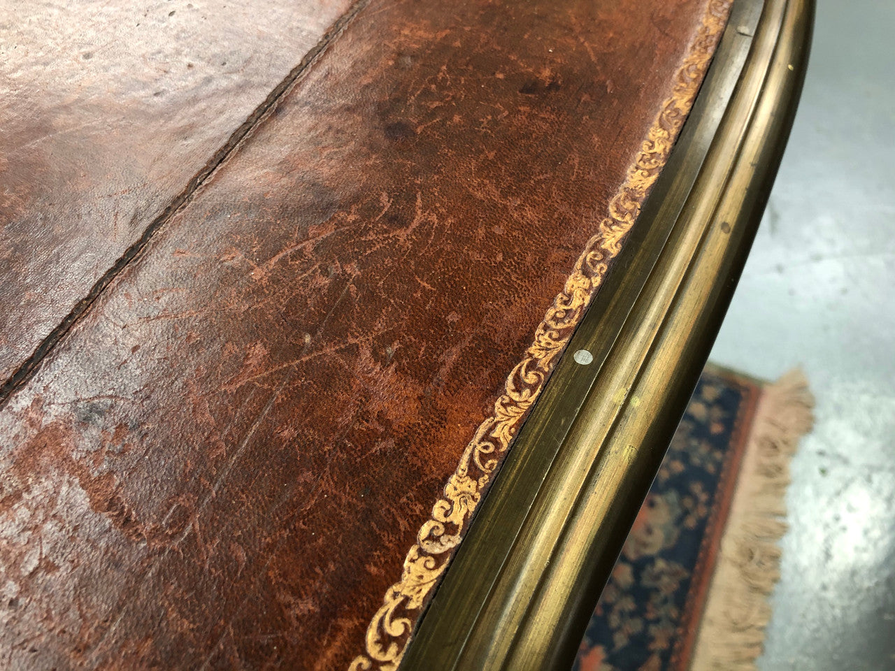An impressive French Walnut petite Bureau Plat with superb ormolu mounts, original tooled leather top with loads of character and drawers for storage. It is in very good original detailed condition.