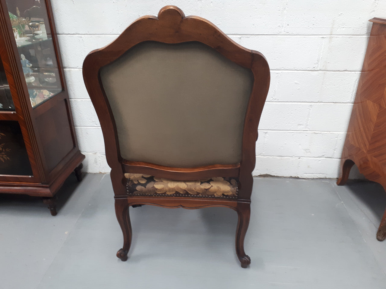 Pair of 19th Century French walnut tapestry covered arm chairs. They are in good original condition. Circa 1890.