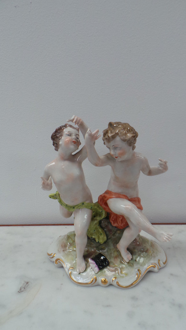 Lovely porcelain 19th century Figurines from the Naples factory. It is in good condition with only slight damage to one finger.