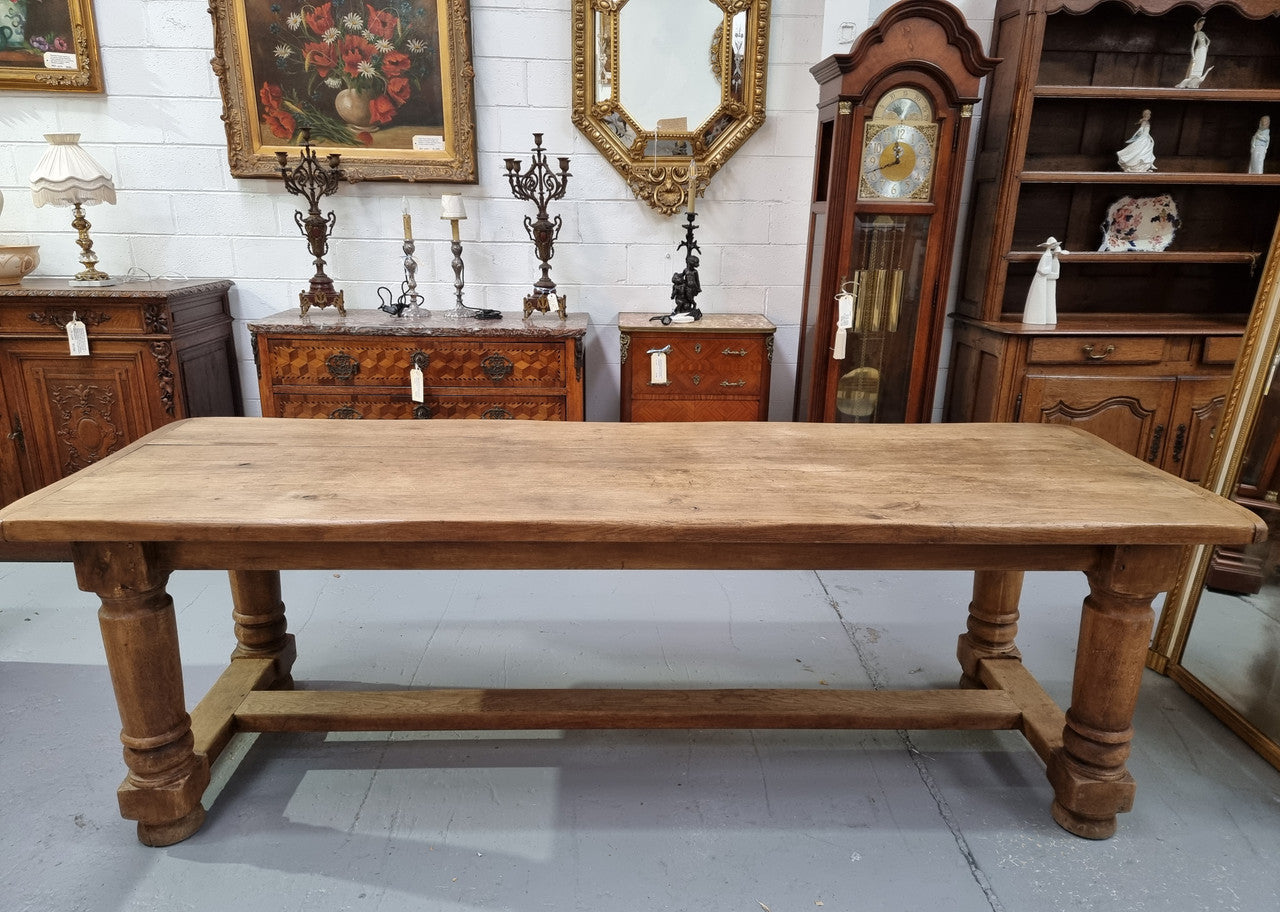 French Oak stretcher base farmhouse table with solid turned legs. It is in good original condition.