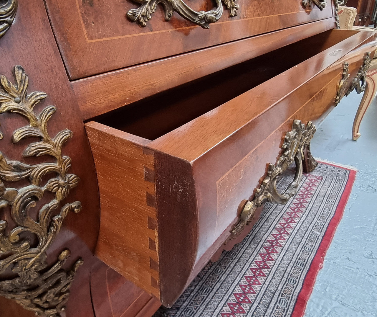 French Louis XVI style three drawer commode with amazing coloured marble. It has decorative brass mounts and is in very good original detailed condition.