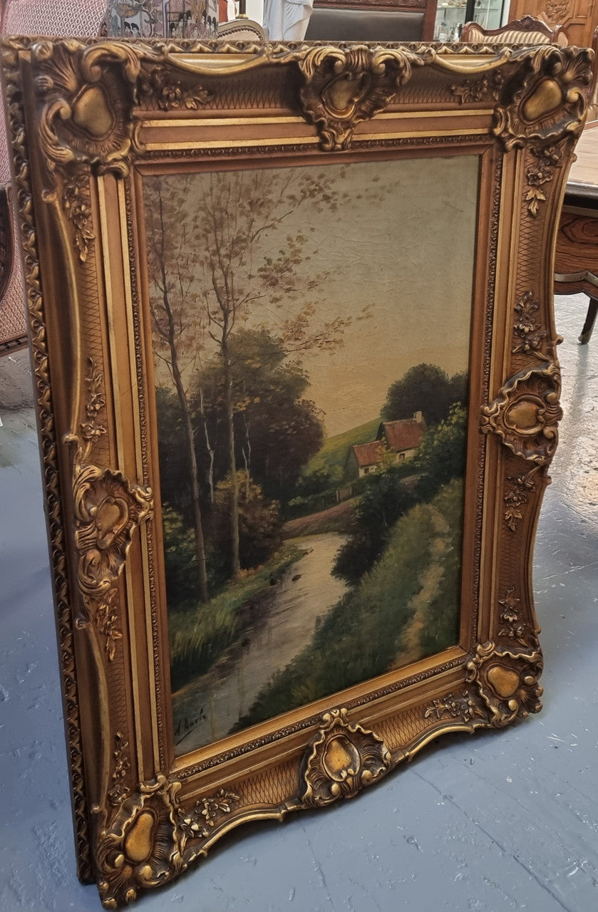 Lovely signed landscape river scene oil on canvas framed in a beautiful ornate frame and in good original condition.