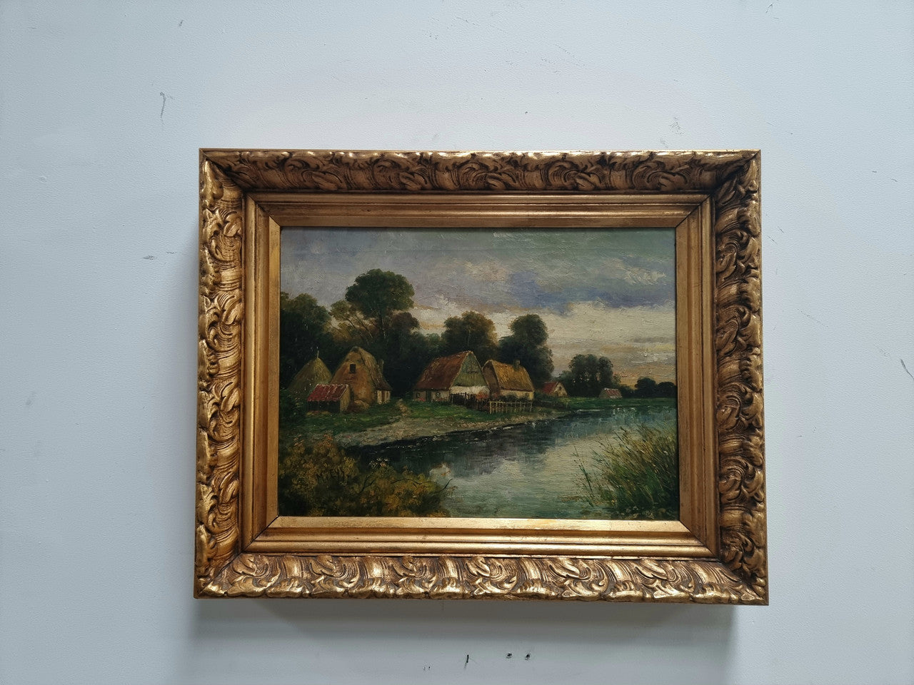 Lovely framed original oil on canvas of a country cottage scene on a river in good original condition