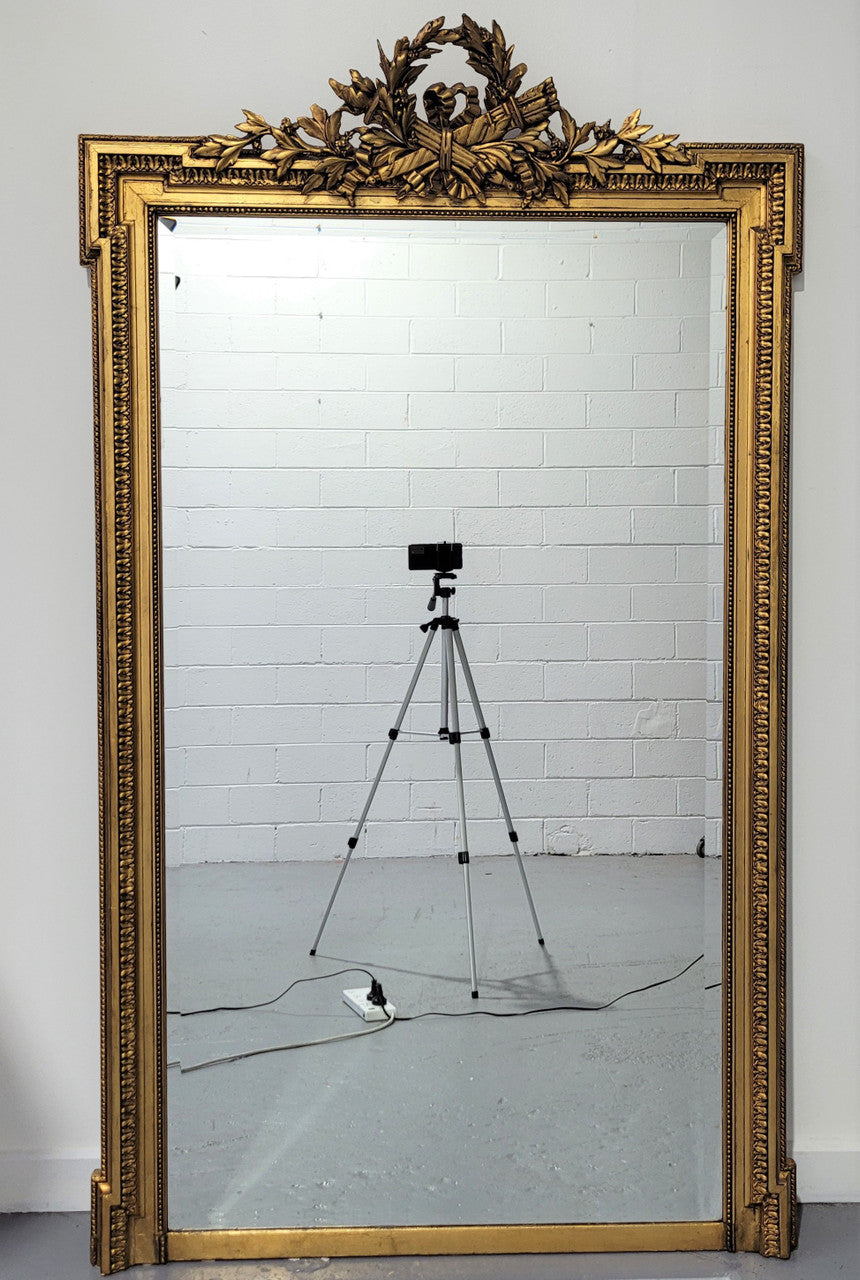 Substantial Louis XI style French Antique over mantel mirror. It is in very good restored condition.