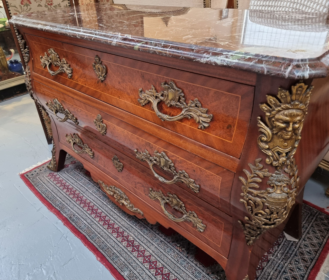 French Louis XVI style three drawer commode with amazing coloured marble. It has decorative brass mounts and is in very good original detailed condition.