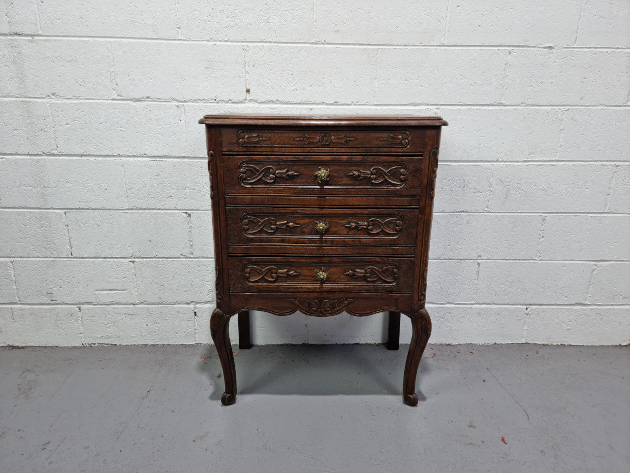 Lovely French dark oak chest of 3 drawers with beautiful carving and details. In good original detailed condition.