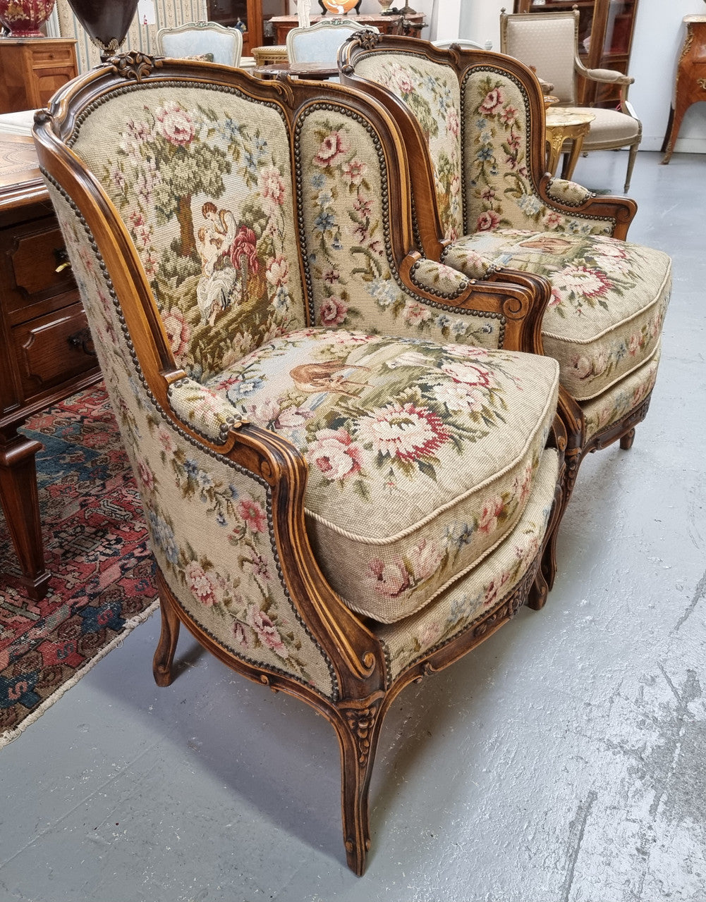 Pair of amazing French Walnut tapestry covered armchairs. The tapestry is in very good condition, please view photos as they form part of the description. Sourced from France and is in good original detailed condition.
