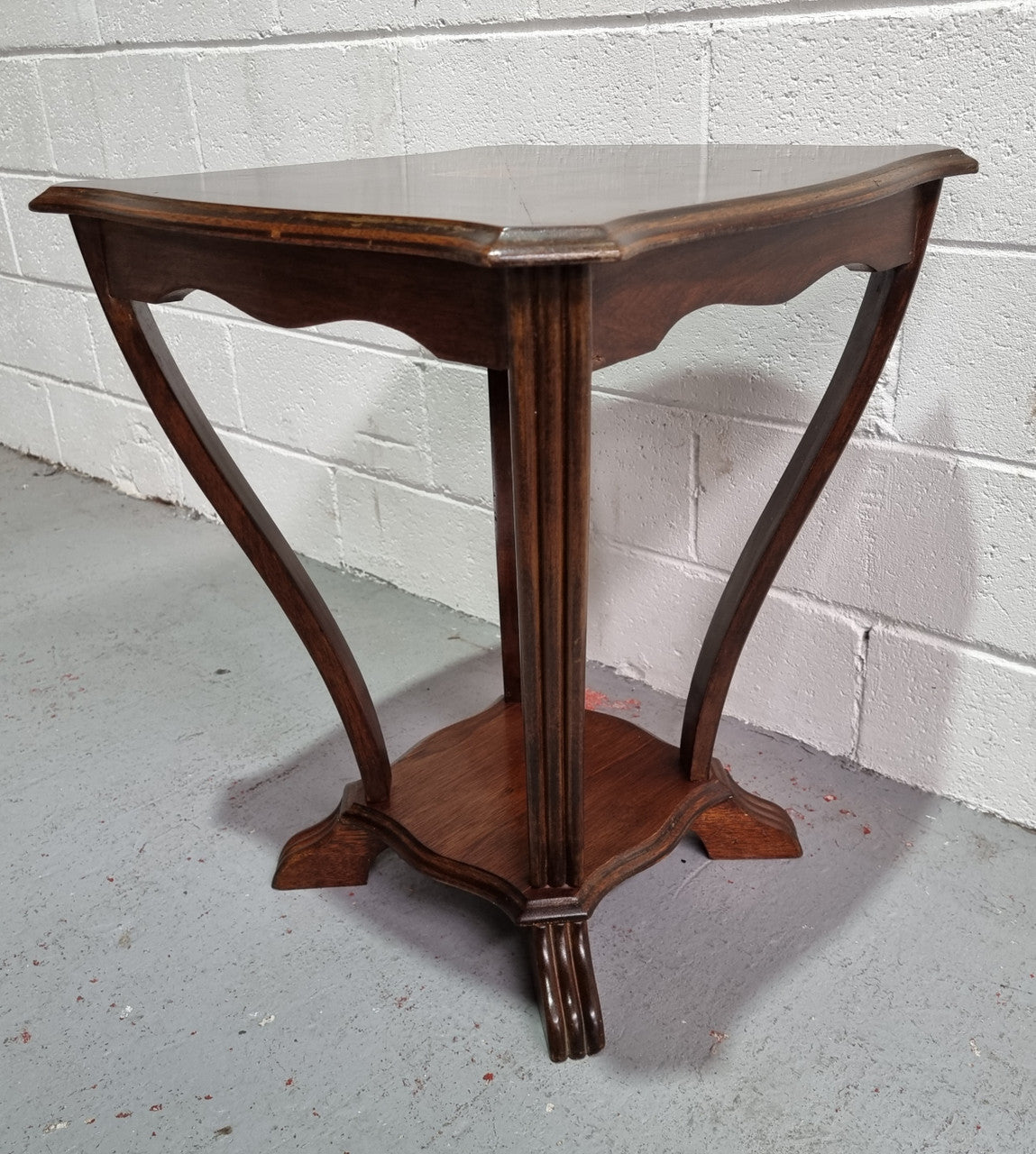 Charming Art Deco Square coffee table. Patterned veneer Top with legs shaping into a lower shelf. In good detailed condition.
