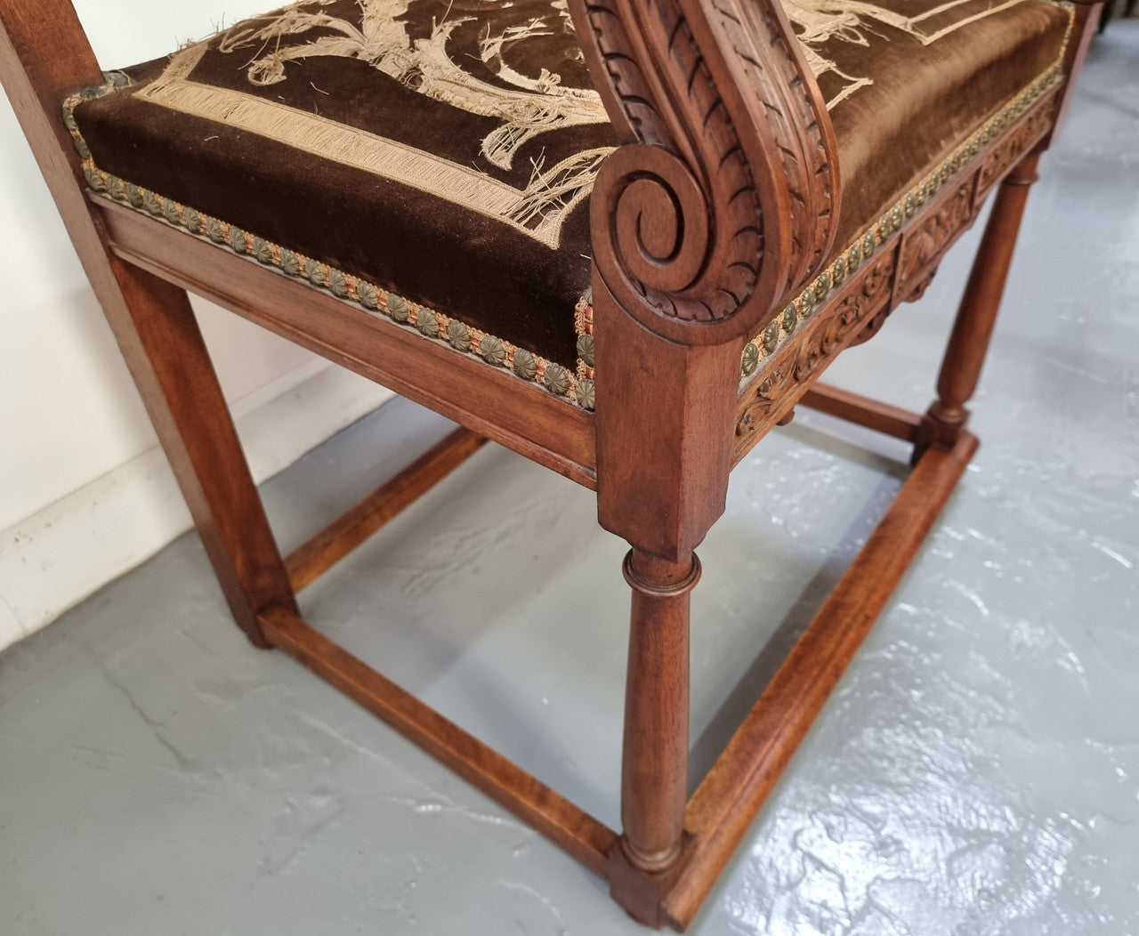 Beautifully carved Walnut Egyptian Revival armchair with amazing hand sewn Stumpwork embroidery coverings. In good original detailed condition.