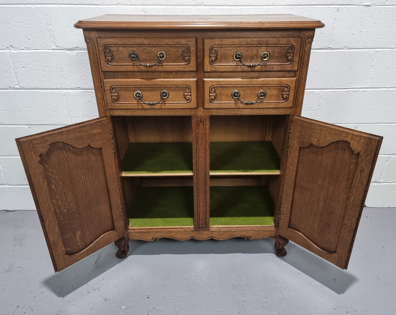 French Oak Louis XV style side cabinet. It has three drawers in total, two small drawers and one deep drawer. In good original detailed condition.