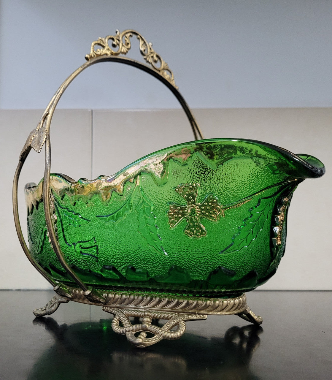 Victorian emerald green and gilt decorated glass bowl with ornate gilt metal stand. It is in good original condition, please view photos as they help form part of the description.