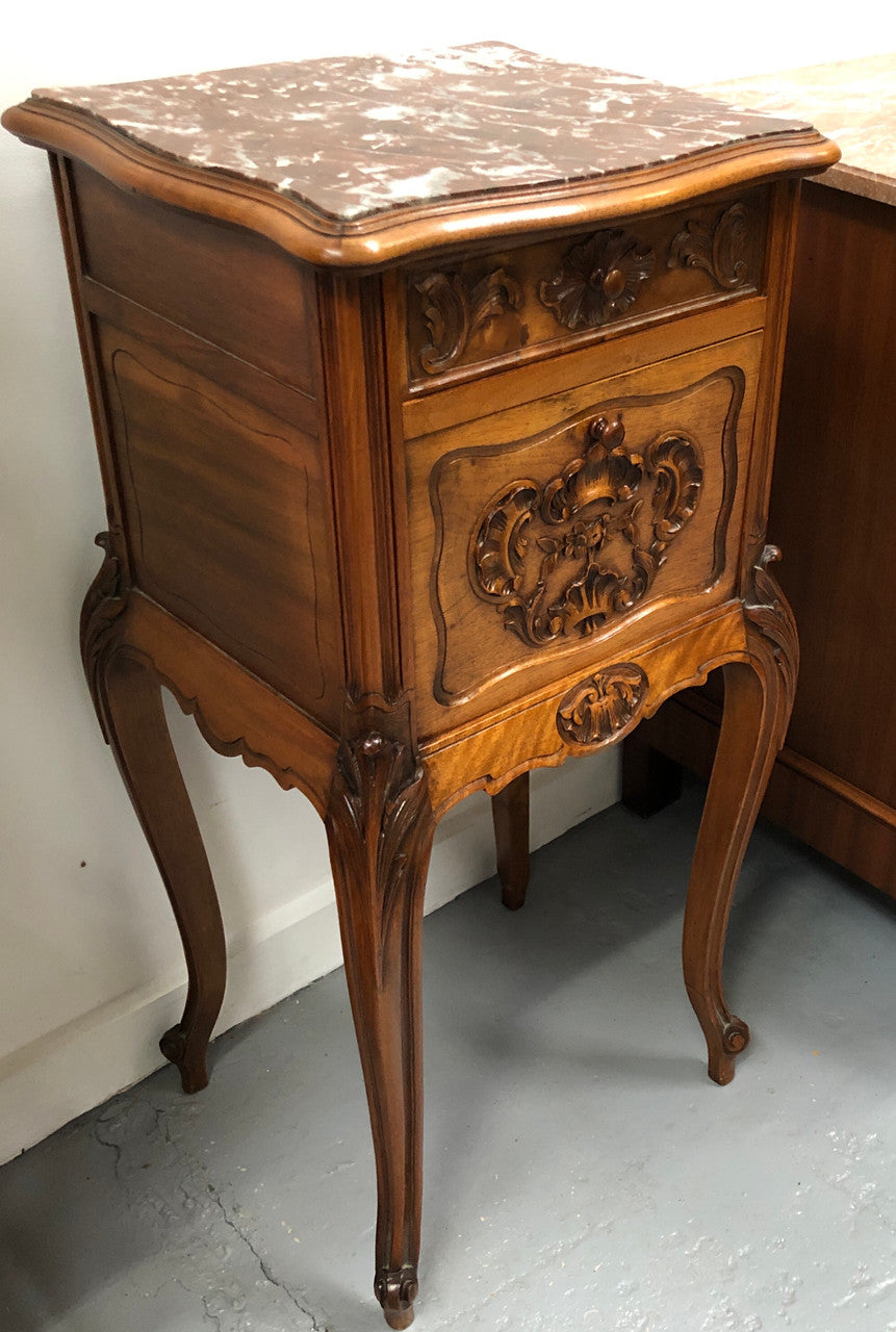 Single French carved bedside with inset marble top. It has beautiful carving and a drawer and cupboard for storage. In very good original detailed condition.