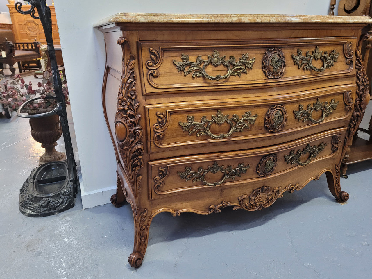 Impressive Louis XV style three drawer walnut commode. Ormolu handles and bevelled marble top complimenting detailed carving. In very good original detailed condition.