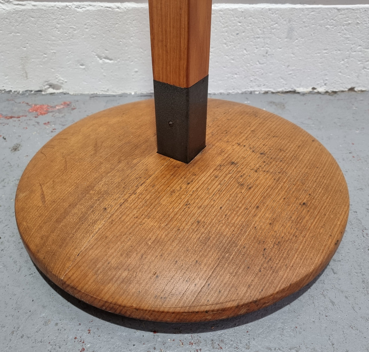 Very sturdy Industrial Queensland maple coat stand on a circular solid base. In good original condition.