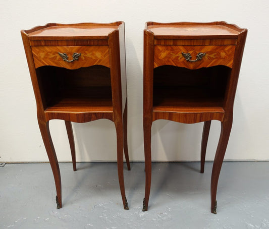 A pair of circa 1950 French marquetry inlaid Kingwood bedside cabinets, in the Louis XV style. In very good original condition.