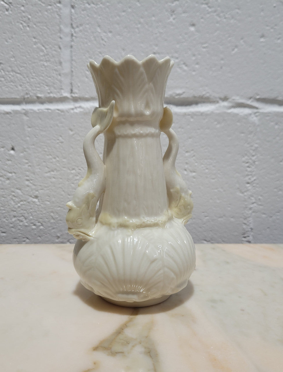 Vintage Belleek Double Handled Fish Vase. Scalloped shell pattern on base & delicate fish handles. Brown Mark 1980 – 1933.