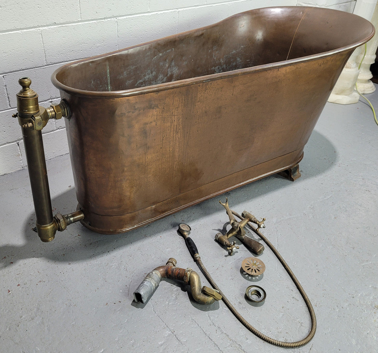 Sourced from France a rare full copper Antique bath tub on feet and includes an overflow, fittings, taps ect. In good original condition.