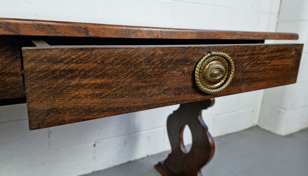 French dark Oak two drawer console table. It has loads of character and is in good original detailed condition.