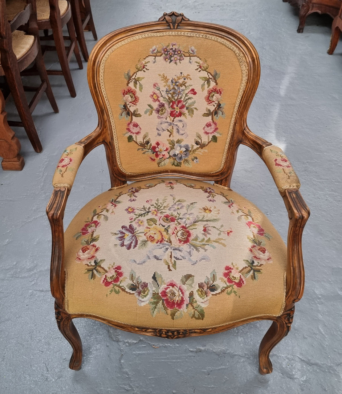 Louis XV style Walnut and tapestry armchair. Very comfortable to sit in and tapestry is in good original used condition.