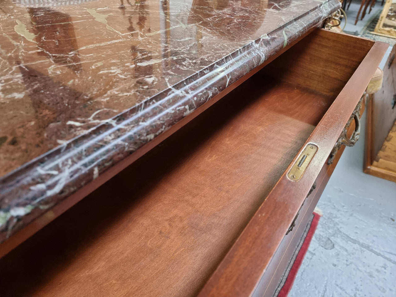 French Louis XVI style three drawer commode with amazing coloured marble. It has decorative brass mounts and is in very good original detailed condition.