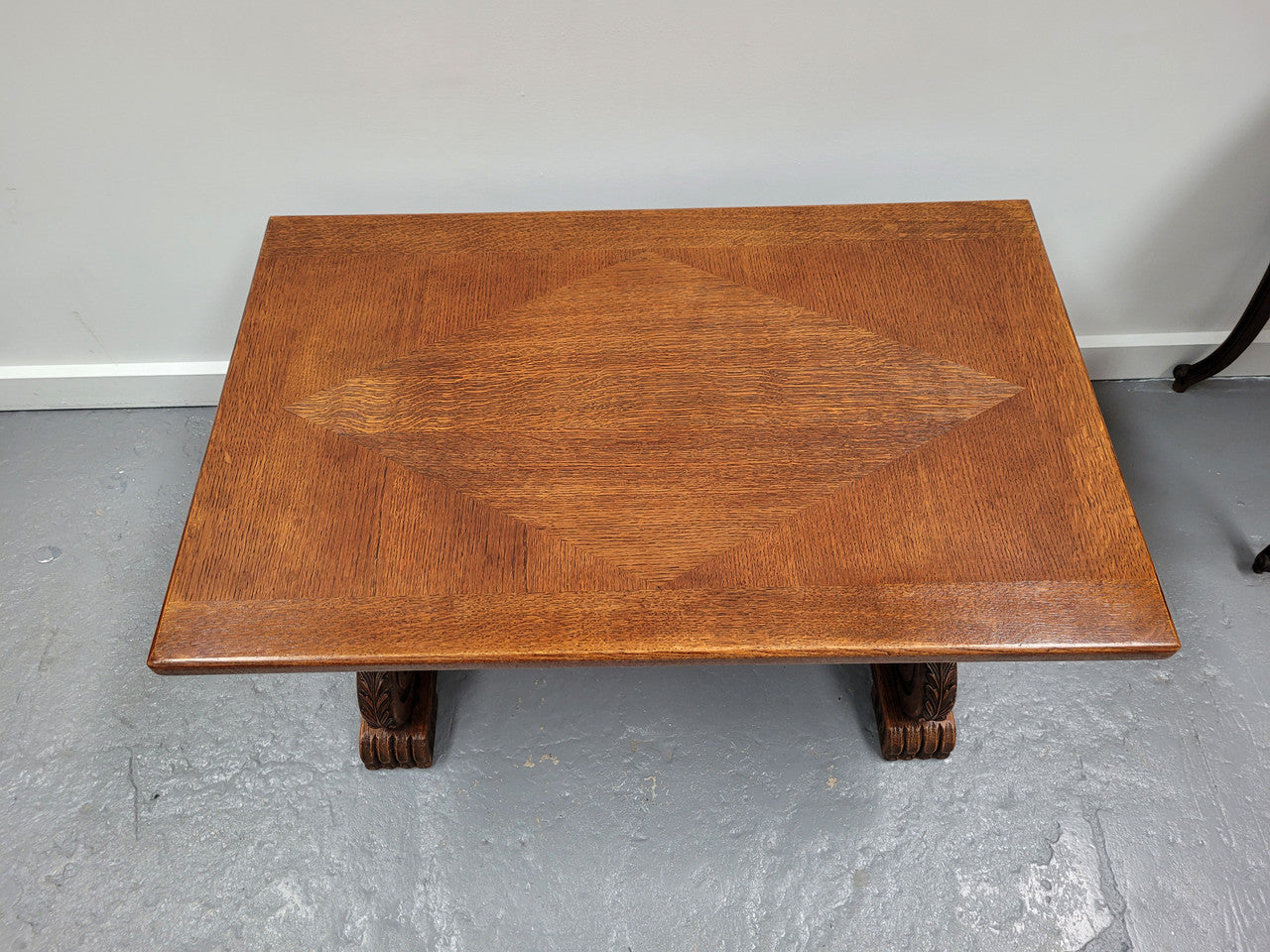 French Oak Spanish style stretcher base coffee table. Sourced From France and is in very good original detailed condition.