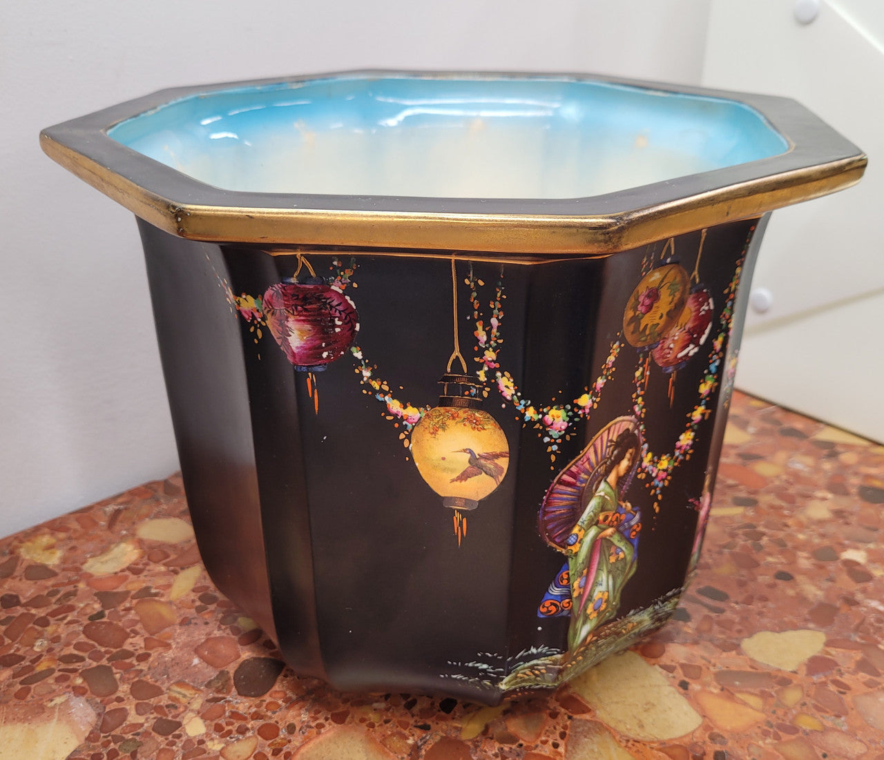 Stunning antique Jardinière with a black background and colorful oriental scene with gold trim. It is in good original condition It is in good original condition please view photos has they help form part of the description. Stamped "Olympic English Make"