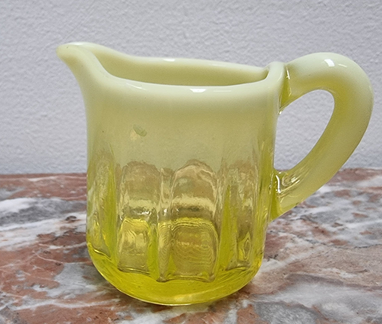A fabulous rare Vaseline glass small jug and sugar bowl in good original condition.