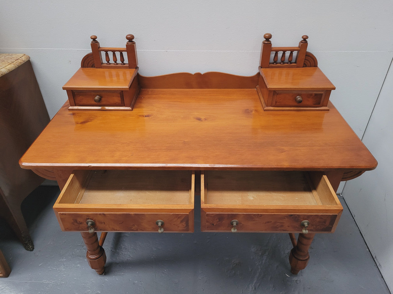 Late Victorian Huon Pine desk with two drawers. Featuring superb birdseye panels and is in good original detailed condition.