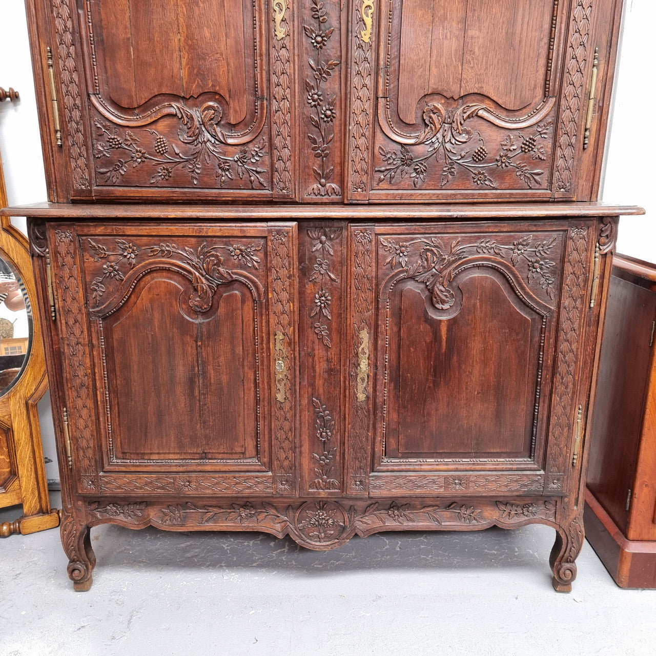 French Oak 18th Century superbly carved sideboard buffet. This amazing buffet has loads of character which is expected being circa 1790's. The top section has two fixed shelves and the bottom section has one fixed shelf. It has been sourced from France and is in good original detailed condition.